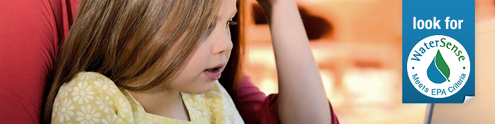 Child viewing a computer.